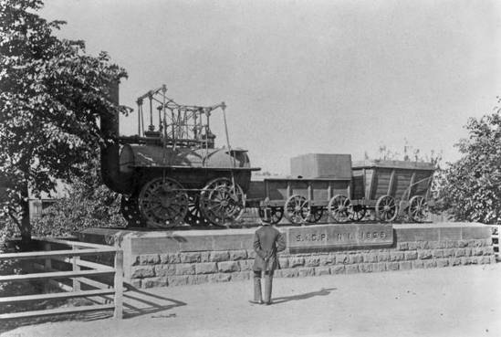 Title: Stockton and Darlington Railway. No1 Locomotion 1825 on plinth outside North Roa.